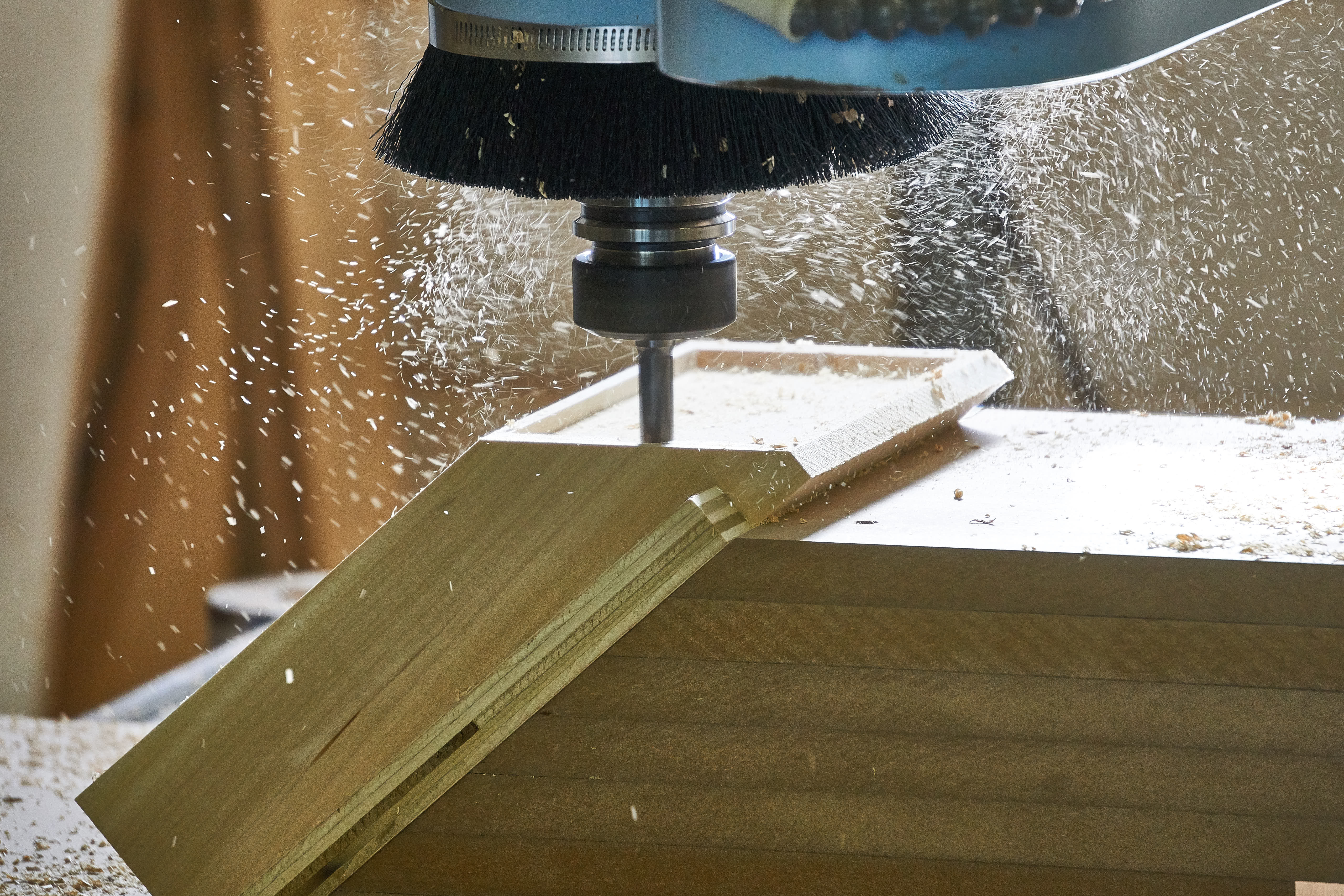 A CNC machine milling a piece of wood