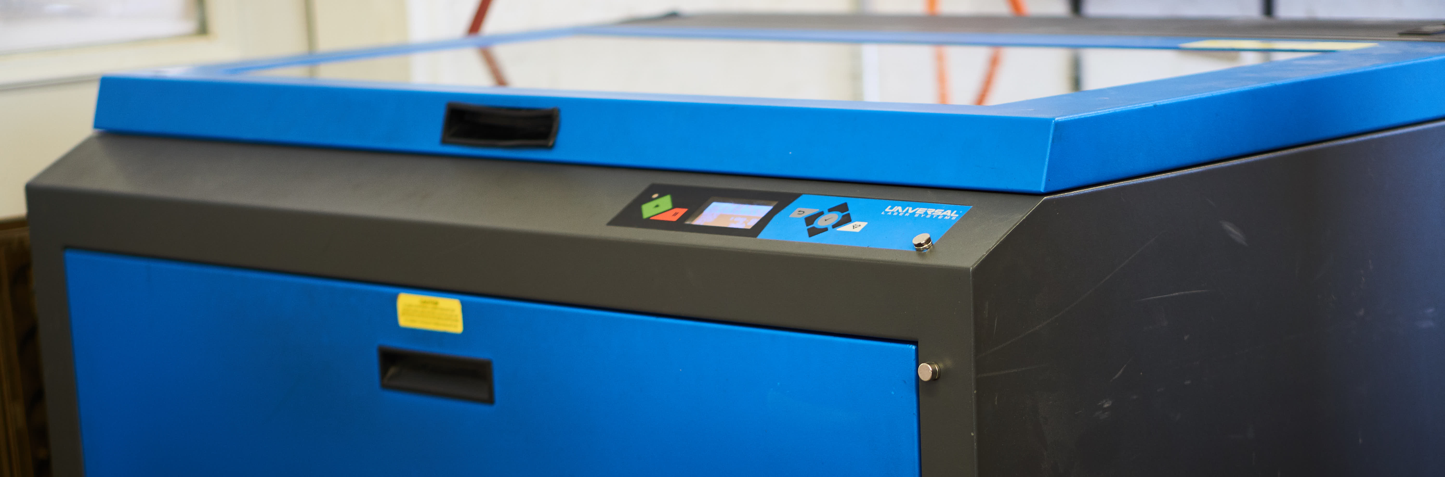 A laser cutting and engraving machine