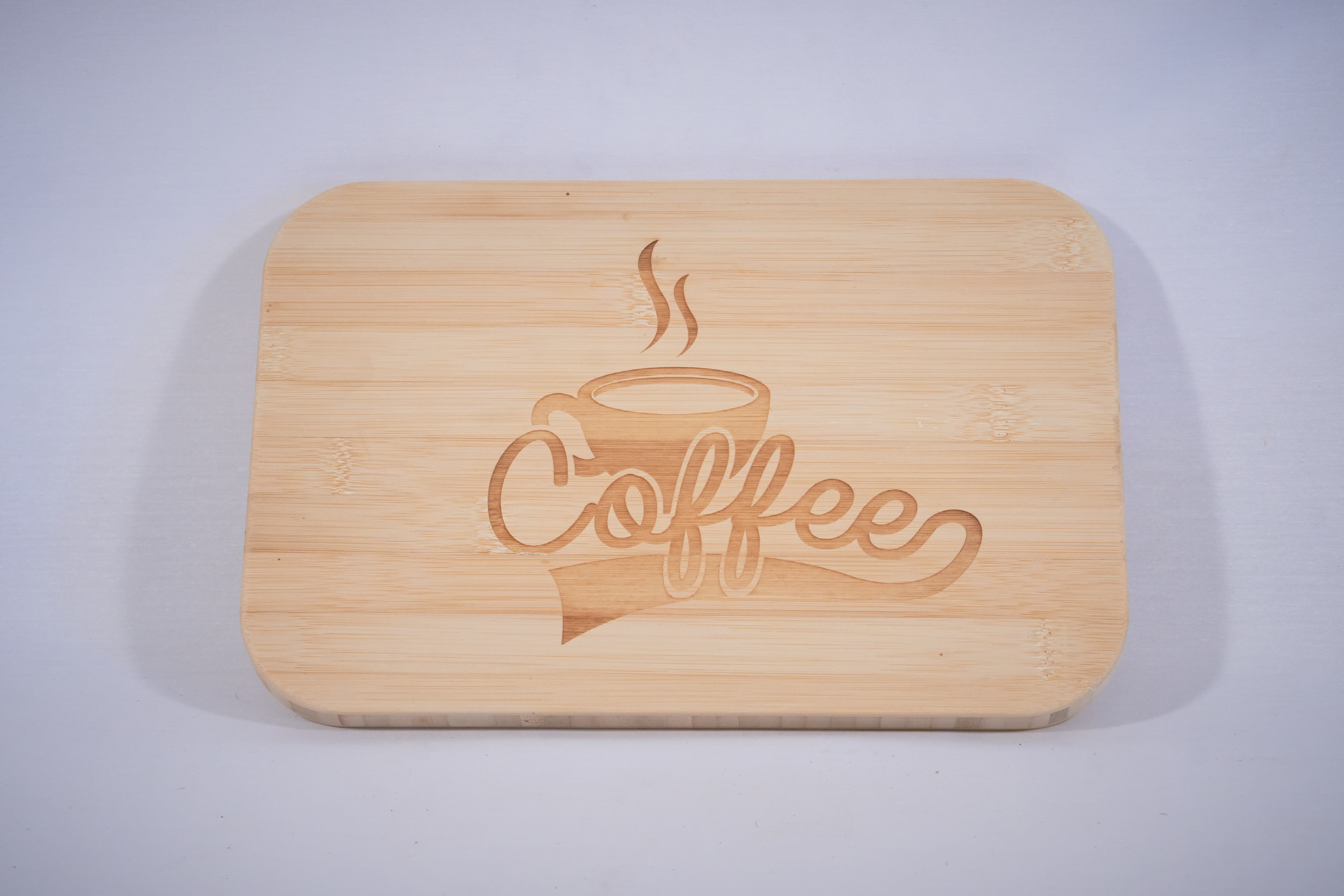 A bamboo cutting board with a laser engraving
