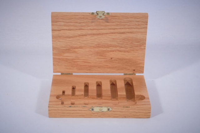 An oak box for storing drill bits